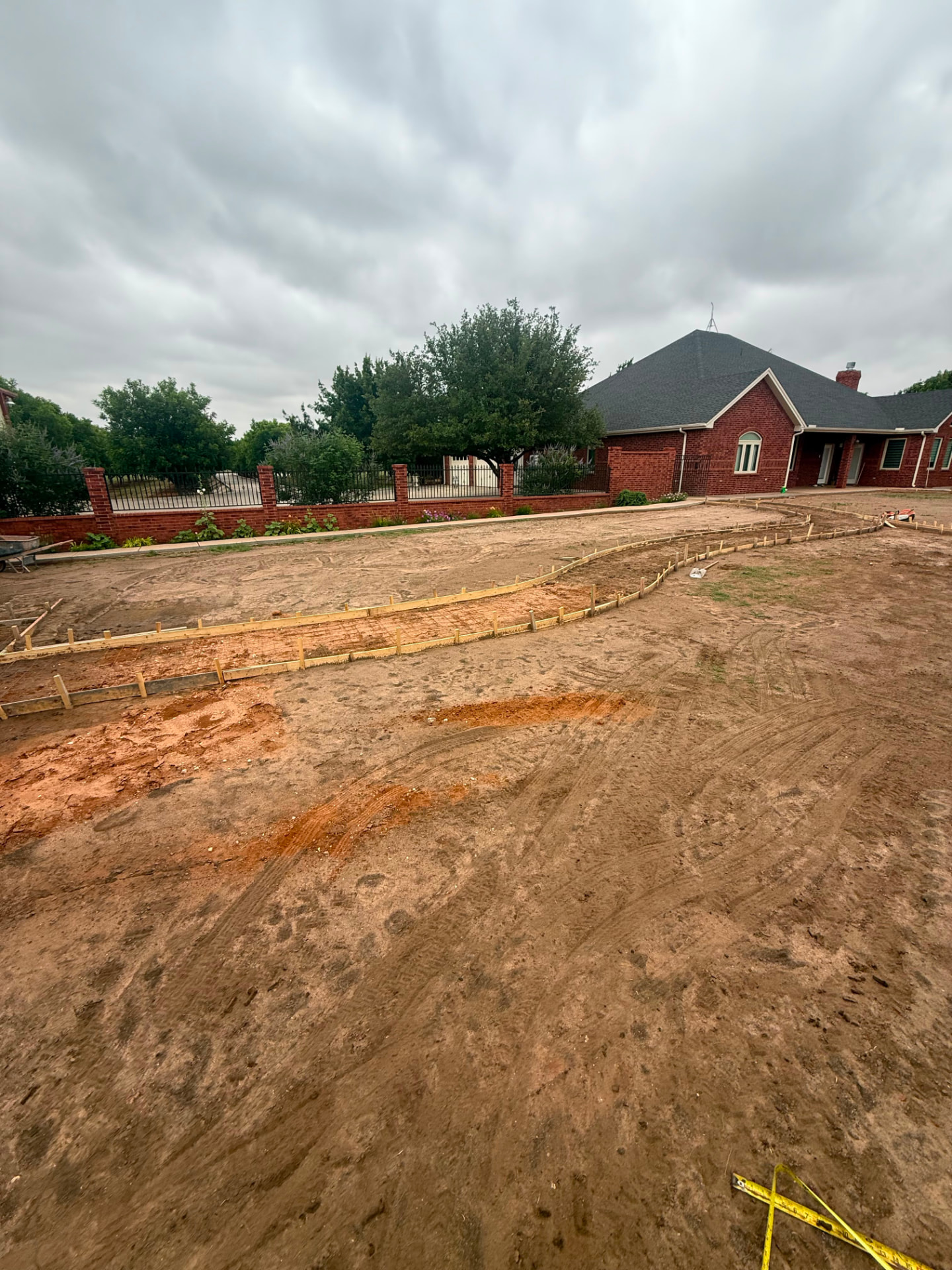 Forms and rebar in place for a curved walkway to the house.