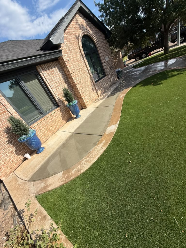 Curved walk with stained border, finished and cleaned up with fresh turf.